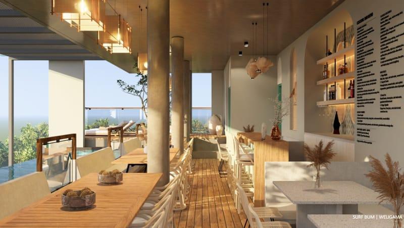 Rooftop restaurant with long timber tables and open sea views